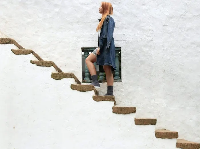 Woman climbing steps outdoors